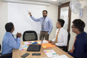 financial analyst giving presentation to board members